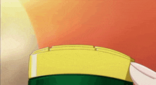a person is holding a yellow and green object