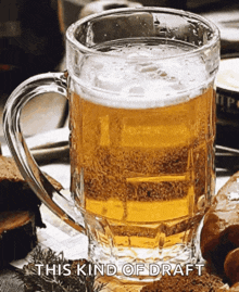 a glass of beer with the words " this kind of draft " on the bottom