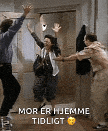 a man and a woman are jumping in the air with the words mor er hemme tidligt written below them