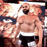 a shirtless man with a beard is wearing shorts that say ruby