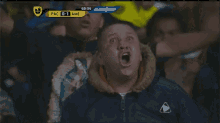 a soccer game between pac and ame is being shown on a television screen