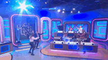 a group of people are standing in front of a stage with a sign that says eltrece on it