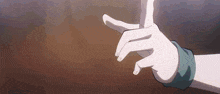 a close up of a person 's hands making a peace sign with their fingers .