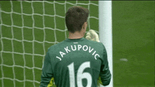 a soccer player with the name jakupovic on the back of his shirt
