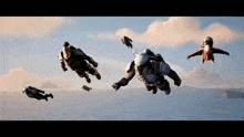 a group of people are flying through the air with jetpacks