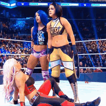a female wrestler wearing a shirt that says bayley
