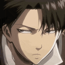 a close up of a anime character 's face with a serious look on his face .