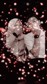 a man and a woman are standing next to each other with a black background