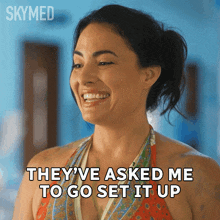 a woman in a bikini is smiling and saying they 've asked me to go set it up
