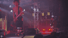 a man playing a guitar in front of a sign that says d7 on it