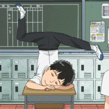a cartoon of a boy sleeping on a desk in front of a chalkboard with chinese writing on it
