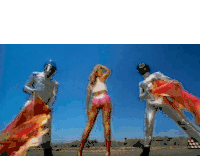 mariah carey is surrounded by disco balls and balloons in a video .