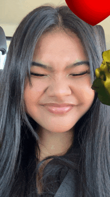 a woman with shrek on her face and a red heart above her head