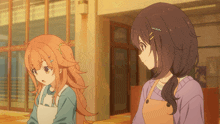 two anime girls are standing next to each other in front of a building