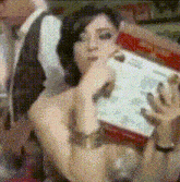 a woman is holding a piece of paper that says ' i 'm sorry ' on it