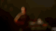a crowd of people with their hands in the air