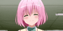 a girl with pink hair has a flower on her head