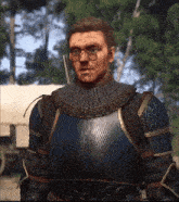 a man in armor has a sword in his hand