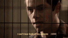 a man behind bars with the words " i can 't lose both of my parents " on the bottom