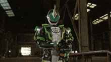 a robot with a green helmet and a glowing eye