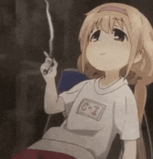 a cartoon girl is sitting in a chair holding a cigarette in her hand .