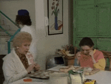 a woman sitting at a table with the words just the one dear
