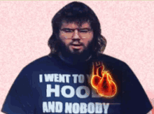 a man with a beard wearing a shirt that says i went to hoo and nobody