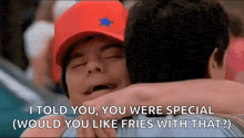 a man in a red hat is hugging another man and says i told you you were special would you like fries with that