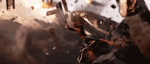 a group of people are flying through the air while a plane is crashing into a building .
