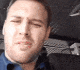 a close up of a man 's face with his eyes closed and his mouth open .