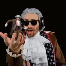 a man in a wig and sunglasses is wearing headphones and a flag scarf