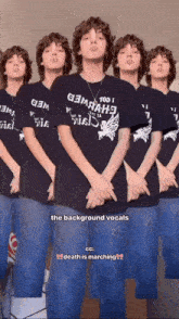 a group of boys are standing in a row with one wearing a shirt that says " death is marching "