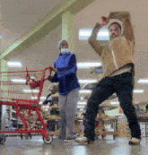 a man and woman are dancing in a grocery store with a sign that says 2 way