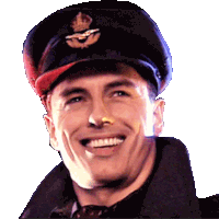 a man wearing a black hat with a crown on it smiles