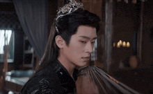 a man with long hair and a crown on his head