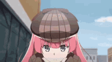 a girl with pink hair is wearing a hat and a jacket .