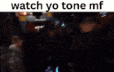 a blurred image of a group of people with the words watch yo tone mf