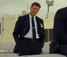 a man in a suit and tie has a badge on his jacket that says ' u.s. air force '