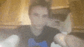 a blurry picture of a man wearing a black shirt