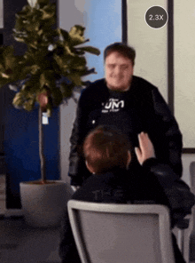 a man wearing a black shirt that says jm1 on it