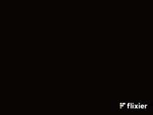 a man wearing headphones and a flixier logo in the corner