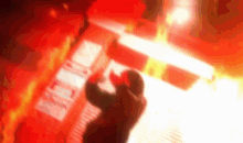 a person is standing in front of a red sign that says ' king ' on it .