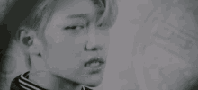 a close up of a person 's face with a blurred background