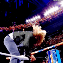 a man in a wrestling ring with the hashtag #thenextbigthing on the bottom