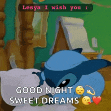 a cartoon character is laying on a bed and wishing someone a good night and sweet dreams .