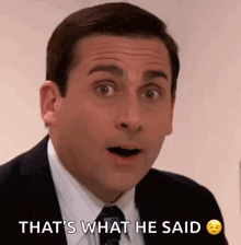 a man in a suit and tie is making a surprised face and saying that 's what he said .