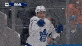 a toronto maple leafs hockey player celebrates his goal
