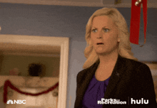 a woman with a surprised look on her face is featured in a nbc ad for parks and recreation