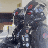 two storm trooper soldiers are standing next to each other in front of a sign that says scottie