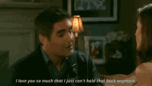 a man and woman are talking in a living room and the man says i love you so much that i just can 't